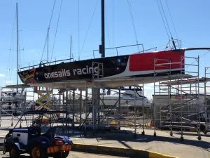 Onesails Racing boat under maintenance on scaffolding